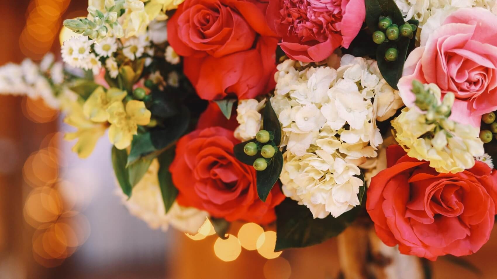 closeup-red-roses-put-white-bouquet-min-scaled-1700x956 (1)-min